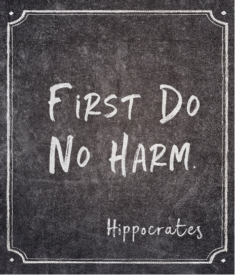 blackboard with text "first do no harm" and signature Hippocrates